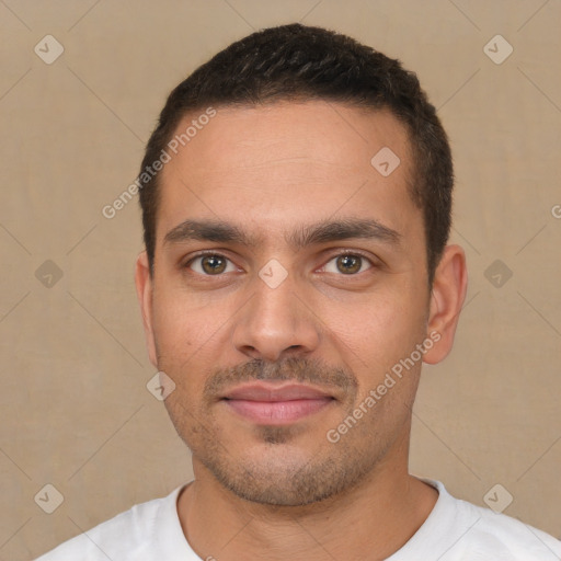 Joyful white young-adult male with short  black hair and brown eyes