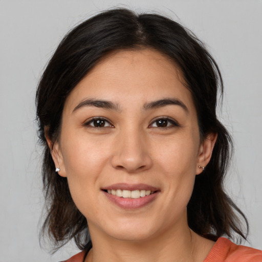 Joyful white young-adult female with medium  brown hair and brown eyes