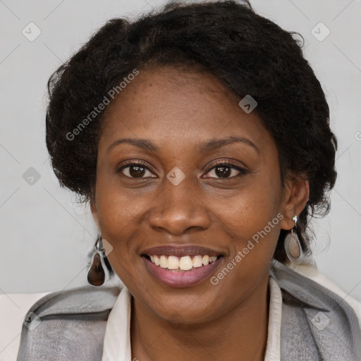 Joyful black adult female with medium  brown hair and brown eyes