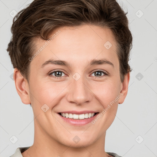 Joyful white young-adult female with short  brown hair and grey eyes