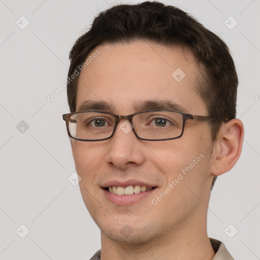 Joyful white young-adult male with short  brown hair and brown eyes