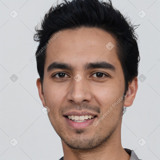 Joyful white young-adult male with short  black hair and brown eyes