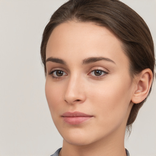 Neutral white young-adult female with medium  brown hair and brown eyes