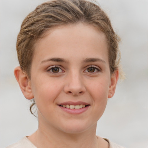 Joyful white child female with short  brown hair and brown eyes