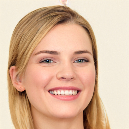 Joyful white young-adult female with long  brown hair and blue eyes