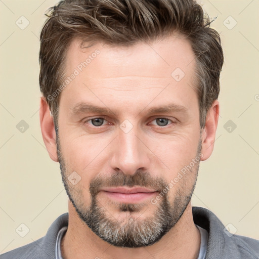 Joyful white adult male with short  brown hair and grey eyes