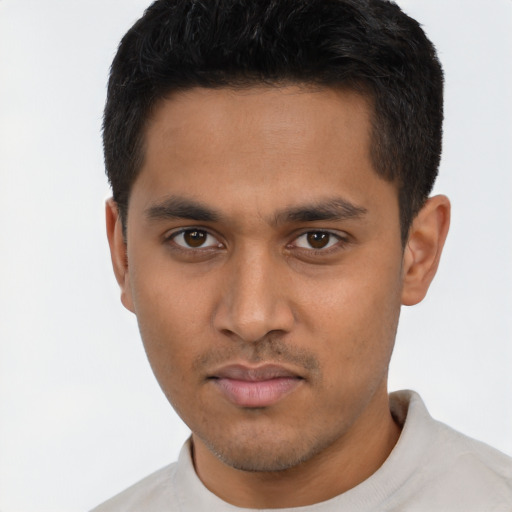 Neutral latino young-adult male with short  brown hair and brown eyes