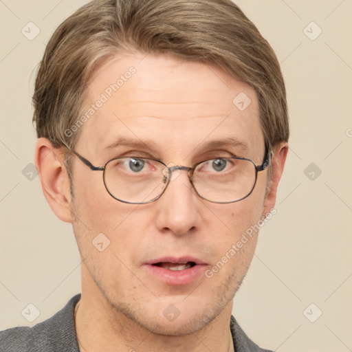 Joyful white adult male with short  brown hair and grey eyes