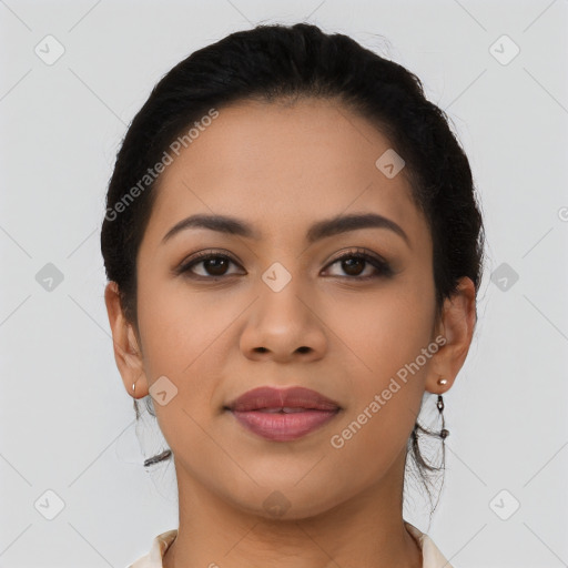 Joyful latino young-adult female with long  brown hair and brown eyes