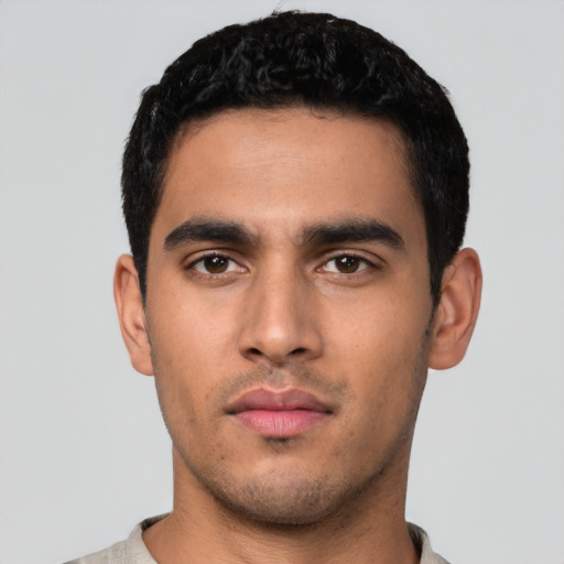 Neutral latino young-adult male with short  black hair and brown eyes