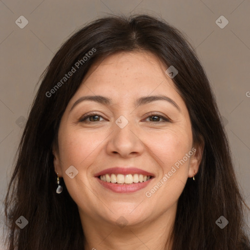 Joyful white adult female with long  brown hair and brown eyes