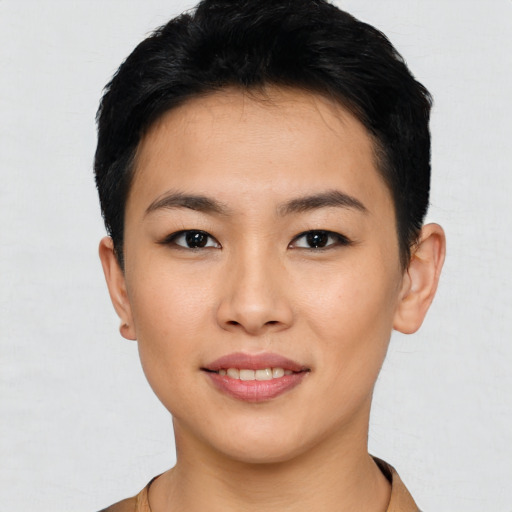 Joyful asian young-adult female with short  black hair and brown eyes