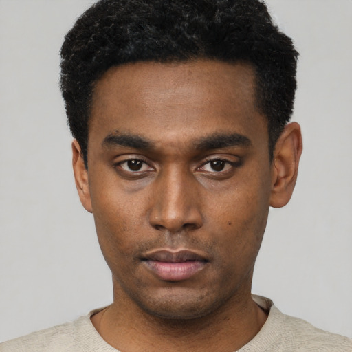 Neutral black young-adult male with short  black hair and brown eyes