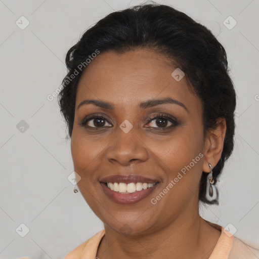 Joyful black young-adult female with medium  brown hair and brown eyes