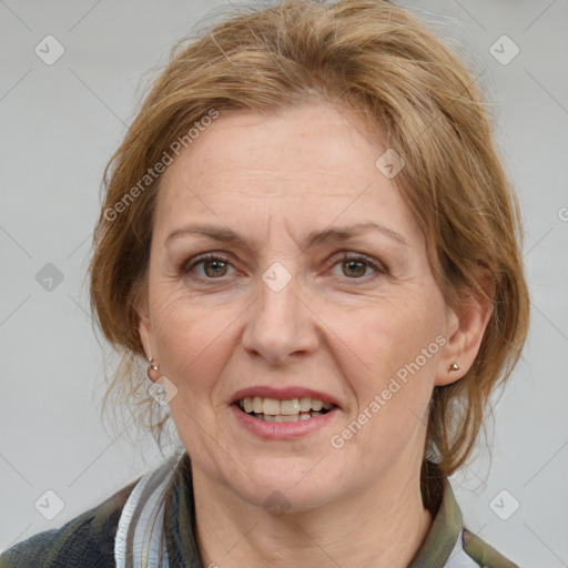 Joyful white adult female with medium  brown hair and grey eyes