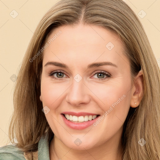 Joyful white young-adult female with long  brown hair and green eyes