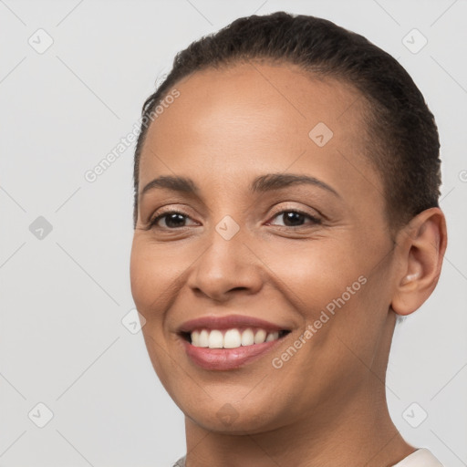 Joyful white young-adult female with short  brown hair and brown eyes