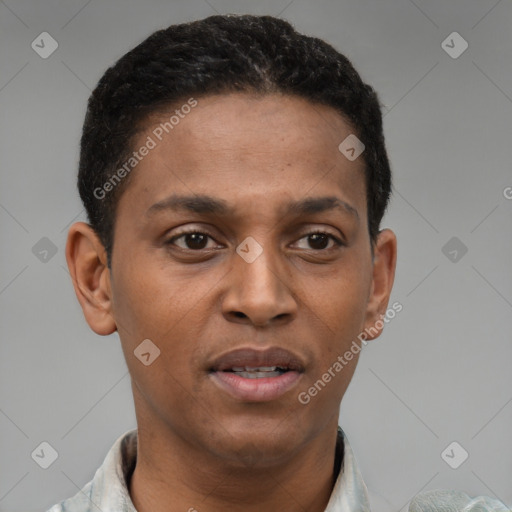Joyful latino young-adult male with short  brown hair and brown eyes