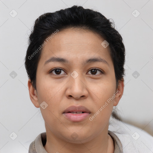 Joyful latino young-adult female with short  brown hair and brown eyes