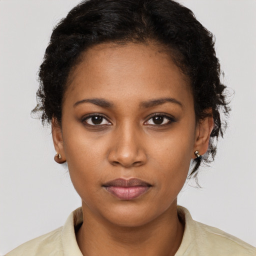 Neutral black young-adult female with short  brown hair and brown eyes
