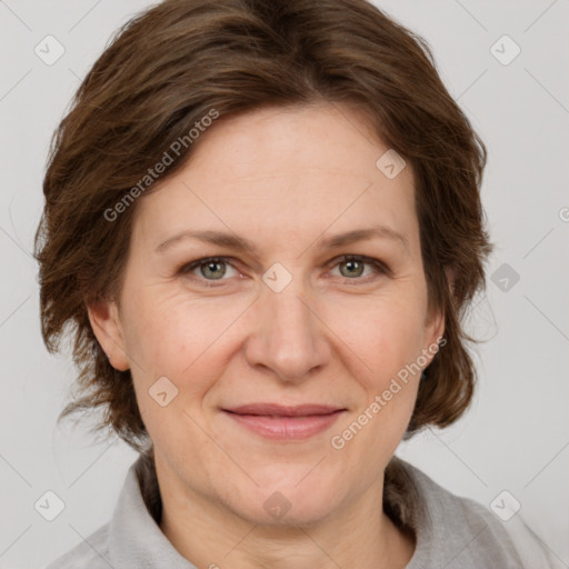 Joyful white adult female with medium  brown hair and grey eyes