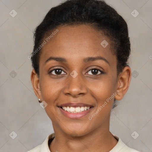 Joyful black young-adult female with short  brown hair and brown eyes