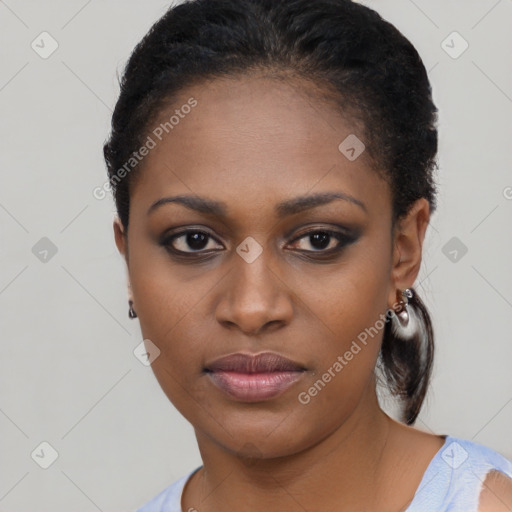 Joyful black young-adult female with short  black hair and brown eyes