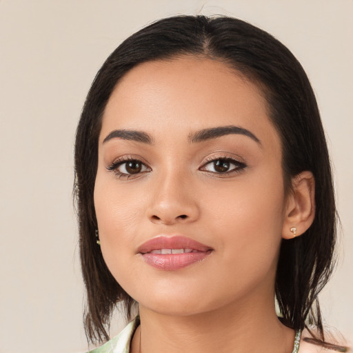 Joyful white young-adult female with medium  black hair and brown eyes