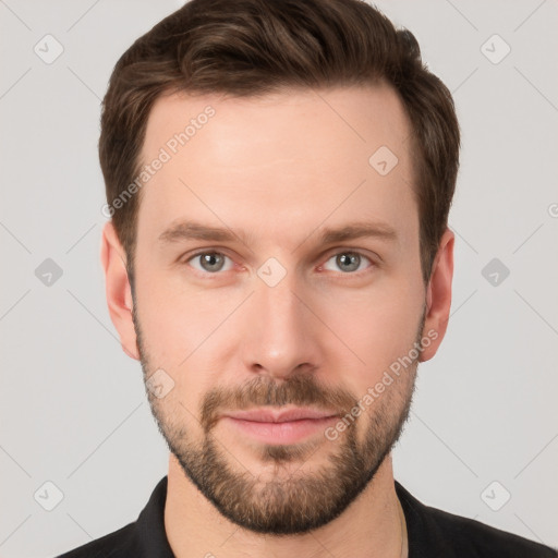 Joyful white young-adult male with short  brown hair and grey eyes