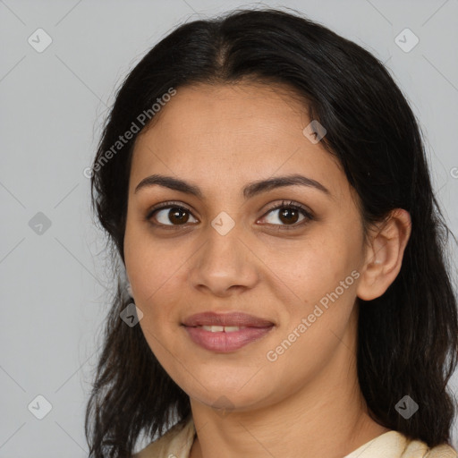 Joyful latino young-adult female with medium  brown hair and brown eyes