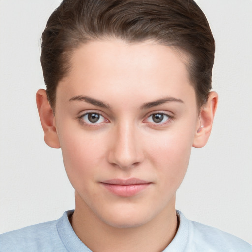 Neutral white young-adult female with short  brown hair and brown eyes