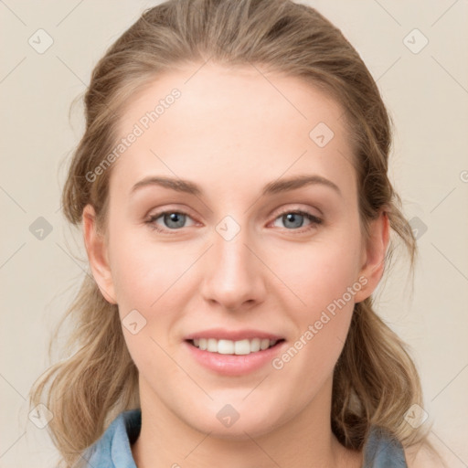 Joyful white young-adult female with medium  brown hair and blue eyes