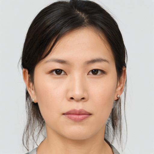 Neutral asian young-adult female with medium  brown hair and brown eyes