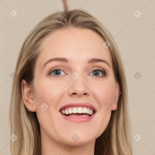 Joyful white young-adult female with long  brown hair and grey eyes