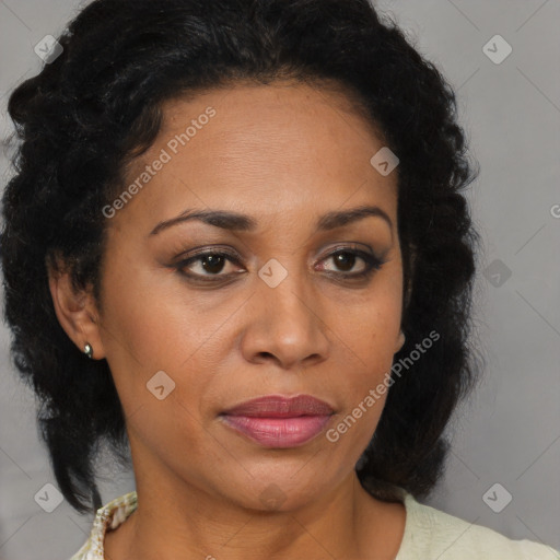 Joyful black adult female with medium  brown hair and brown eyes