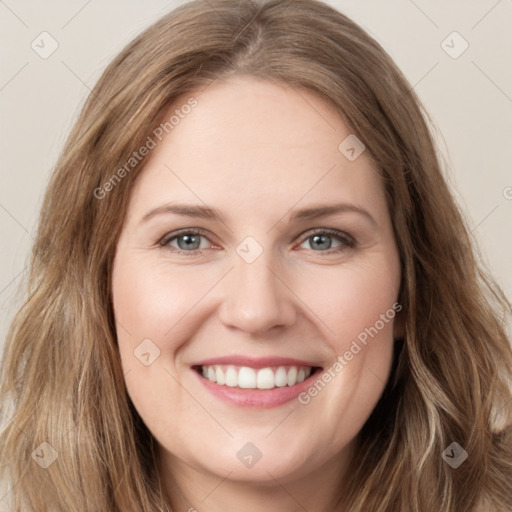 Joyful white young-adult female with long  brown hair and green eyes