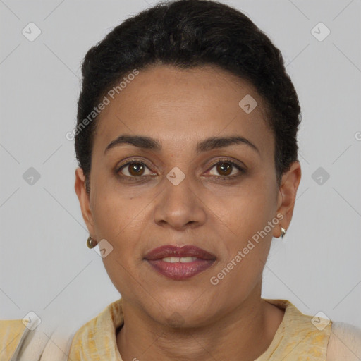 Joyful black adult female with short  brown hair and brown eyes