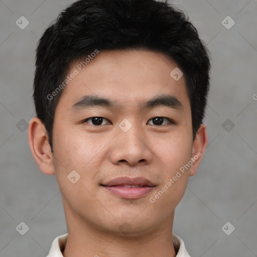 Joyful asian young-adult male with short  black hair and brown eyes