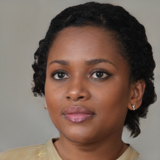 Neutral black young-adult female with medium  black hair and brown eyes