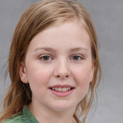 Joyful white child female with medium  brown hair and blue eyes