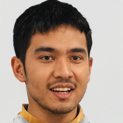 Joyful asian young-adult male with short  brown hair and brown eyes