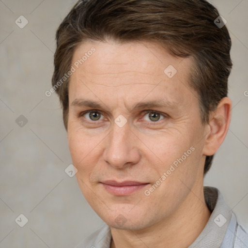 Joyful white adult male with short  brown hair and brown eyes