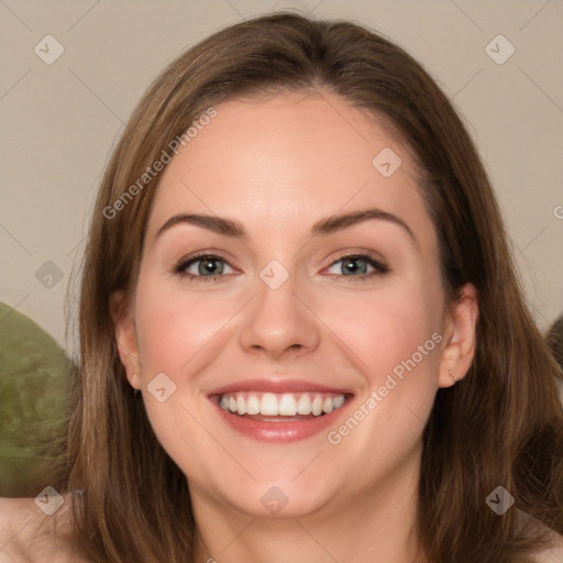 Joyful white young-adult female with long  brown hair and green eyes