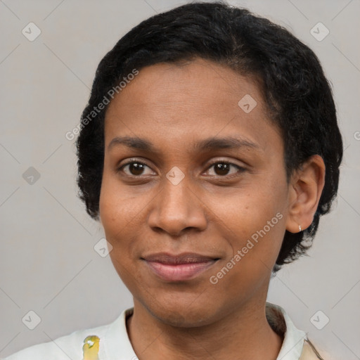 Joyful black young-adult female with short  brown hair and brown eyes