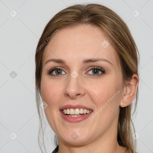 Joyful white young-adult female with medium  brown hair and blue eyes