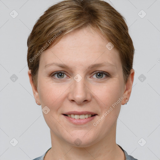 Joyful white adult female with short  brown hair and grey eyes