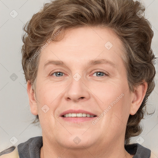 Joyful white adult female with short  brown hair and grey eyes