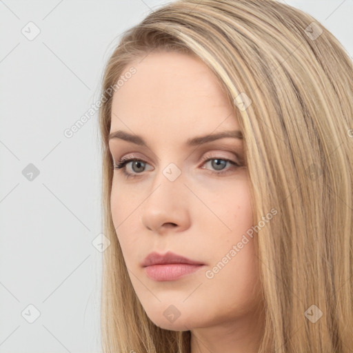 Neutral white young-adult female with long  brown hair and brown eyes