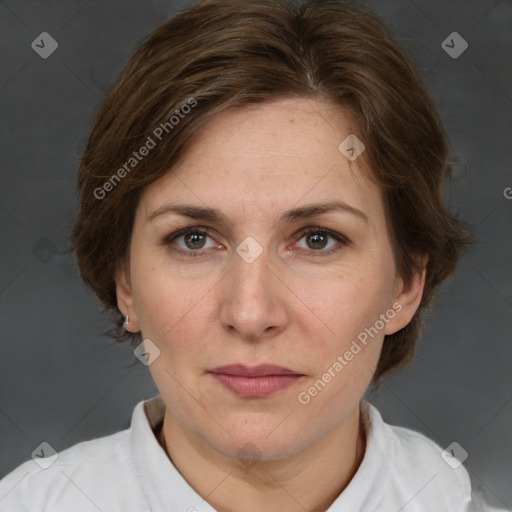 Joyful white adult female with medium  brown hair and grey eyes