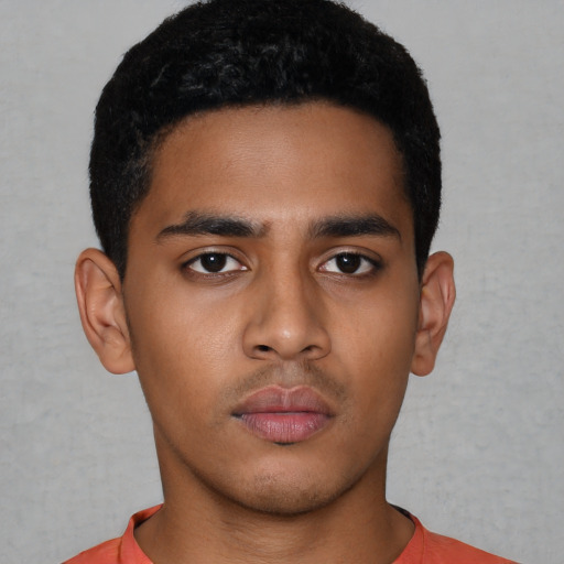 Neutral latino young-adult male with short  black hair and brown eyes